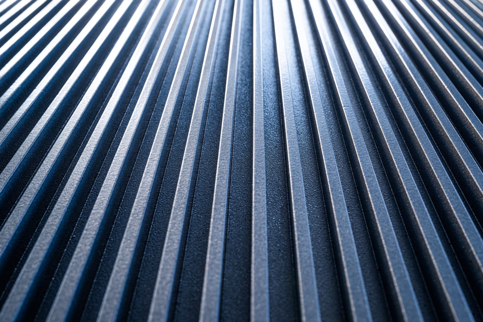 Close-up of a corrugated metal surface of unidentified military equipment. The concept of sophisticated equipment and modern technology. Home appliance manufacturing concept